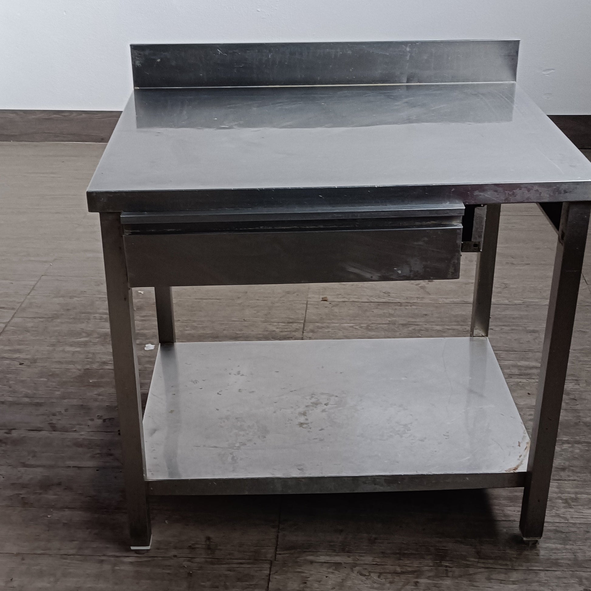 tavolo acciaio inox 90 x 70 con ripiano e cassetto 